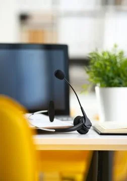Empty remote office workplace with laptop and headset Foto stock