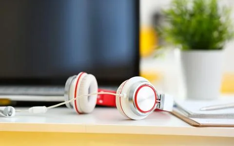 Empty remote office workplace with laptop and headset Foto stock