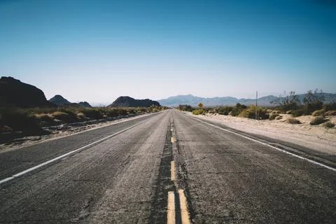 Empty remote route of dry valley in USA Stock Photos