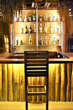 An empty resort bar with a lone stool Stock Photos