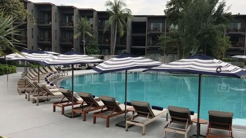 Empty resort hotel swimming pool Stock Footage 79534966