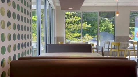 Empty Restaurant Booth Interior with Windows and Outside Traffic Stock Footage 345918318