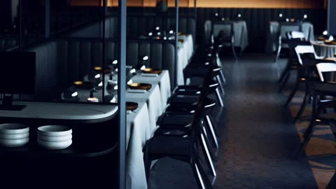 Empty restaurant interior during evening hours with tables set for dining Stock Footage 343935132