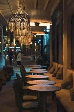 An empty restaurant at night in Moscow. Empty tables on the outdoor terrace Stock Photos