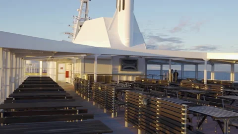 Empty restaurant on outside deck passenger cruise ship ferry during Coronavirus Stock Footage 153273352