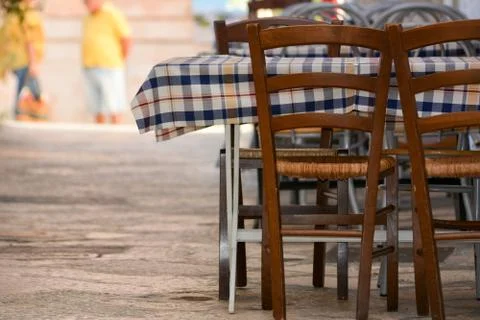 An empty restaurant table in the street Stock Photos