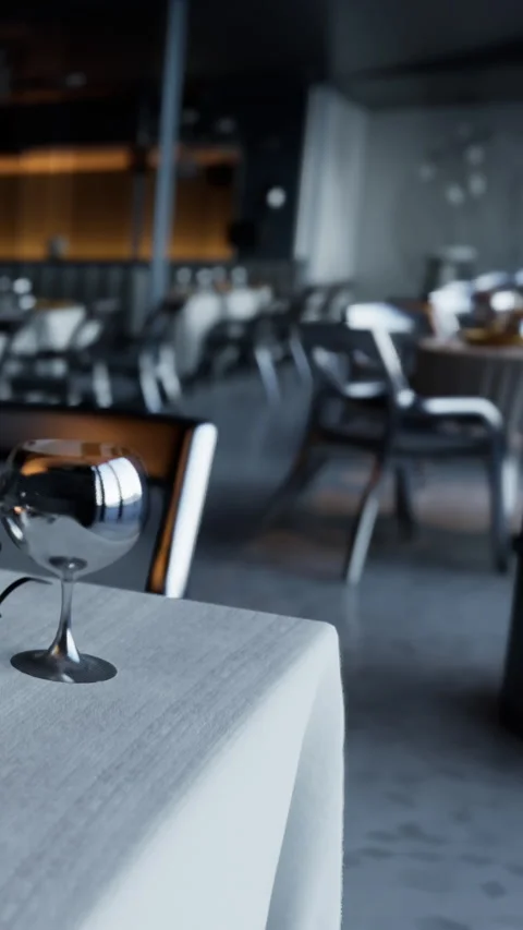 Empty restaurant with tables and chairs set up for dining in the evening Stock Footage 338379942