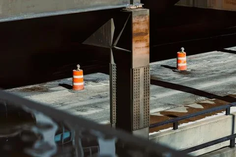 Empty restaurant tables with safety cones in modern dining space Stock Photos