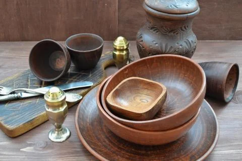 Empty restaurant tableware. Rustic wooden brown background. Stock Photos