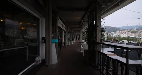 Empty restaurant terrace Varazze harbor early evening. POV, walking Stock Footage 337017000
