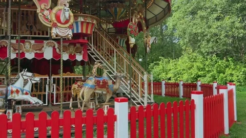 Empty retro merry-go-round carousel in summer park Stock Footage 250532679