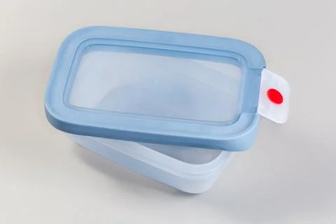 Empty reusable plastic lunch box with open lid atop Stock Photos