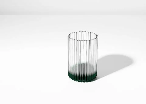 Empty ribbed glass with colored bottom on empty white studio surface with a copy Illustrazione stock