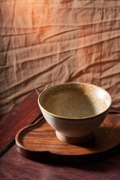 An empty rice bowl tableware with a retro wooden background Stock-Fotos