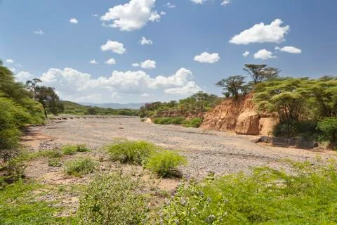 An empty river bed between Marigat and Lake Baringo in Kenya during dry seaso Stock Photos