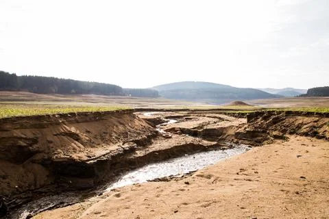 Empty river. Drought land texture, summers dry, cracked soil, ground on the Stock Photos