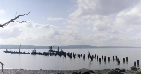 Empty River Front with damaged wooden posts. 4K Stock Footage 138535341