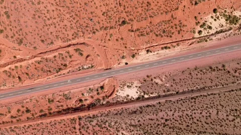 Empty road across the red desert. Aerial view. Stock Footage 285428969