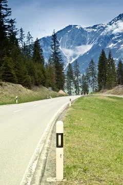 Empty road in the alps Stock Photos