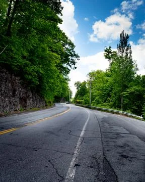 The empty road and the cloudy sky Stock Photos
