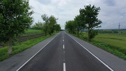 Empty road and green fields aerial view Stock Footage 158697705