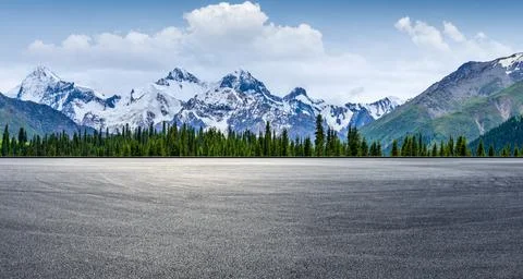Empty road and snow mountain nature background. Stock Photos