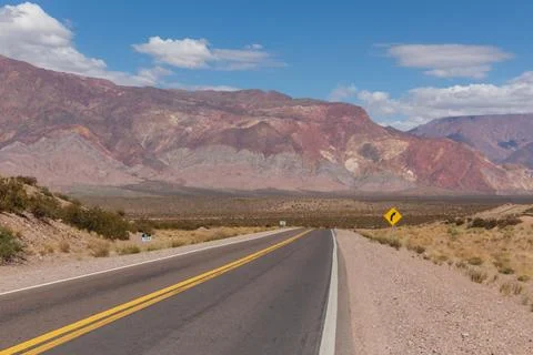 Empty road in Argentina towards the border with Chile in the Andes. Stock Photos