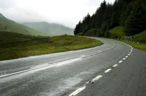 Empty road between mountains. Stock Photos