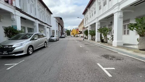 Empty road between shophouses Stock Footage 169509954