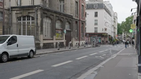 Empty road with bicycle lane near residential buildings on Paris street Stock Footage 336722981