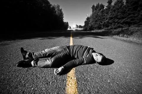 Empty road with dead body in the middle Foto stock