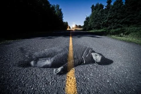 Empty road with dead body's ghost in the middle 写真素材