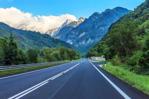 Empty road high in the Alpine mountains Stock Photos