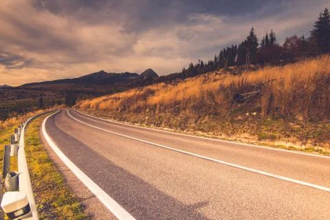 Empty road in high mountains Stock Photos