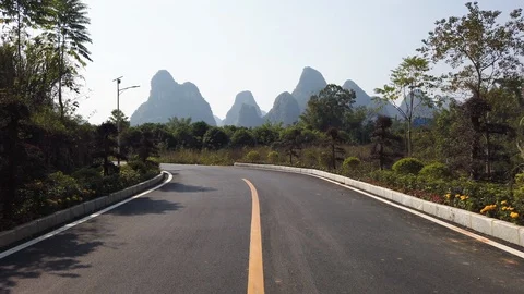 Empty road with hills in Yangshuo Stock Footage 127350673