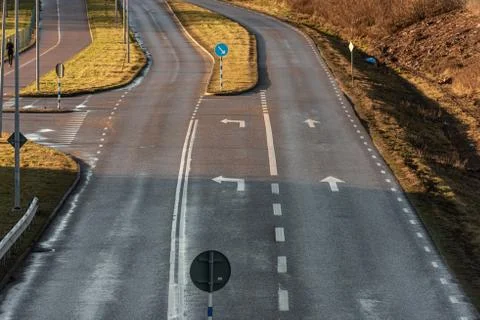 Empty road junction with one plus two lanes. Stock Photos