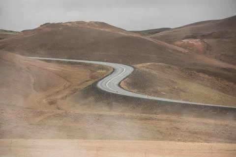 Empty Road leading through the mountain landscape looks like a big symmetric S Stock Photos