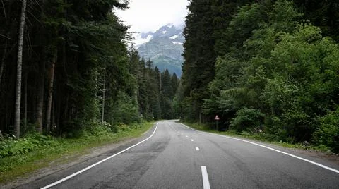Empty road in mountain forest Stock Photos