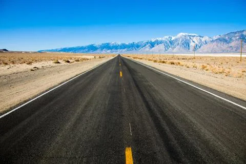 Empty road with mountains Stock Photos