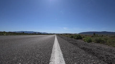Empty Road Nevada Hwy 93 low angle tracking Stock Footage 64877400