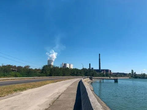 Empty road next to thermal power plant dam Stock Photos