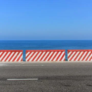 Empty road -  ocean and blue sky background Stock Photos