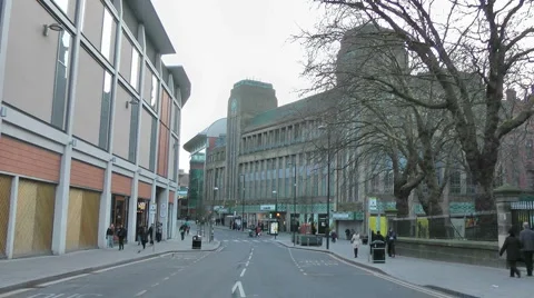 Empty road with pedestrians walking on both pavements Stock Footage 1087572