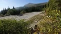 Empty road running in mountains, mountain top covered in rocks, nature, sequence HD Footage