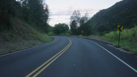 Empty road running through vast tropical rainforest and mountains Stock Footage 141800556