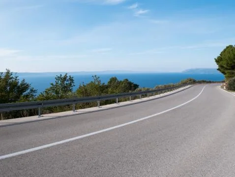 Empty road with sea view Stock-Fotos