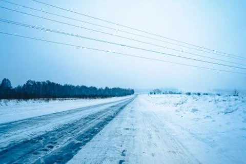 Empty road in snow Stock Photos