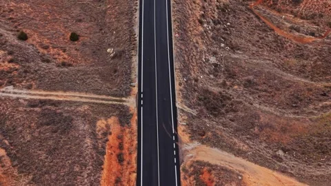Empty road in Spain surrounded by dry landscape and rocky terrain Stock-Footage 333112879