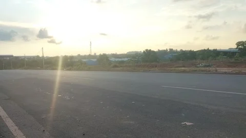 Empty Road at Sunset with Golden Sky and Lens Flare Stock Footage 308565734