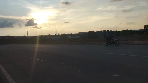 Empty Road at Sunset with Golden Sky and Clouds 動画素材 308567655